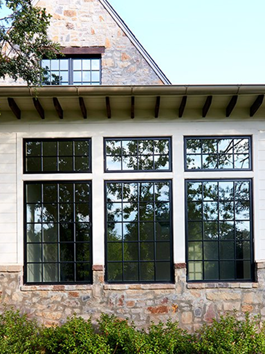 Pella Impervia Black Casement Windows with Picture Transoms.